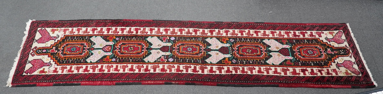 A Turkish red ground geometric runner, 266 x 63cm. Condition - good